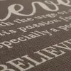 A close-up view of text printed on a textured fabric surface. Produktbild-Vorschau