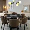 A dining room setting with a table, chairs, and a sectional sofa. Produktbild-Vorschau
