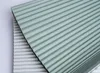 Two pleated blinds are shown, one on top of the other, with a diagonal split. Produktbild-Vorschau