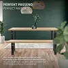 A dining table and bench set with modern industrial-style legs, set against a dark green wall and wooden floor. Náhled obrázku produktu
