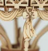 A close-up of a wooden hot air balloon model, focusing on a decorative bow and draped fabric detail. Anteprima dell’immagine prodotto