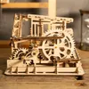 A close-up of a wooden marble run construction kit with gears and balls. Podgląd zdjęcia produktu