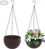 Two hanging flower baskets, one empty and one filled with flowers, against a white background. Produktbild-Vorschau