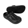 A pair of black clogs shown from a slightly elevated angle, with one clog placed in front of the other. Produktbild-Vorschau