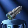 A car charger with two USB ports is displayed on a blue reflective surface against a dark blue gradient background. Podgląd zdjęcia produktu
