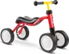 A red PUKY WUTSCH balance bike with black wheels and seat, and a yellow handlebar. Produktbild-Vorschau