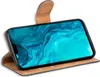 A smartphone in a brown flip case, displayed at an angle. Náhľad obrázku produktu
