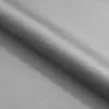A close-up, angled view of a gray fabric, likely upholstery, with folds and shadows. Voir les images du produit