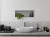 A modern bathroom vanity with a built-in shelf, sink, and accessories. Náhled obrázku produktu