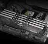 A close-up shot of computer RAM modules installed on a motherboard. Náhled obrázku produktu