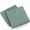 Two green fabric storage boxes are shown on a white background. Anteprima dell’immagine prodotto
