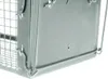 A close-up view of a metal trap. Voir les images du produit