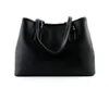A black leather tote bag is shown against a white background. Produktbild-Vorschau