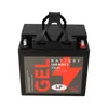 A black battery with a red and gray label, shown from a diagonal angle against a white background. Voir les images du produit