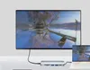 A USB-C hub adapter is shown connected to a large monitor and a laptop, displaying a serene landscape image. Produktbild-Vorschau