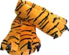 A pair of plush tiger paw slippers. Náhled obrázku produktu
