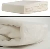 A folded blanket is shown from two different angles against a white background. Produktbild-Vorschau