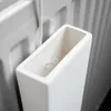 A close-up view of a white ceramic radiator humidifier attached to a white radiator. Produktbild-Vorschau