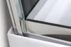 A close-up view of the corner of a shower enclosure, showing the glass and metal frame. Produktbild-Vorschau