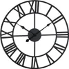 A black metal wall clock with Roman numerals. Produktbild-Vorschau