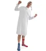 A man wearing a white nightgown and a nightcap, with mismatched striped socks, is stretching and smiling against a white background. Produktbild-Vorschau