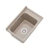 A top-down view of a beige sink with a drain and a ribbed drying area. Anteprima dell’immagine prodotto