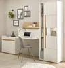 A home office setup featuring a white and wood-tone desk with a fold-down writing surface, a chair, and a tall white cabinet with wood accents. Produktbild-Vorschau