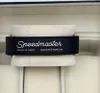 A close-up of a watch strap with text on it, placed inside a watch box. Podgląd zdjęcia produktu
