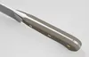 A close-up view of the handle and part of the blade of a knife. Voir les images du produit
