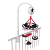 A baby mobile with musical features attached to a crib railing. Produktbild-Vorschau