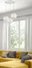 A modern living room with a yellow sectional sofa and a large window with white curtains. Produktbild-Vorschau