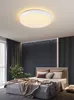 A bedroom scene with a bed, curtains, a plant, and a ceiling light. Náhľad obrázku produktu
