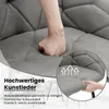 A close-up of a person's hand pressing into a padded chair seat, with text overlays describing the material and features. Produktbild-Vorschau