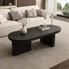 A modern living room scene with a couch and coffee table. Voir les images du produit
