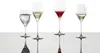 Four wine glasses filled with different beverages, displayed on a reflective surface against a white background. Náhľad obrázku produktu