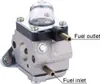 A close-up view of a carburetor with labels indicating fuel inlet and outlet. Produktbild-Vorschau