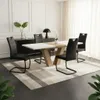 A dining set with a table and chairs in a modern dining room. Produktbild-Vorschau