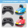 Two remote-controlled bumper cars, one blue and one red, are shown with their respective controllers. Produktbild-Vorschau