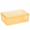 A clear studio shot of a single transparent yellow shoe organizer box. Anteprima dell’immagine prodotto