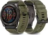 A Garmin Fenix smartwatch with a green nylon strap is shown against a white background. The watch face displays various metrics, and a second watch strap is visible. Anteprima dell’immagine prodotto