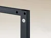 Close-up of the corner of a black metal frame with a white circular sticker with a black 'G' logo. Náhled obrázku produktu