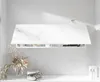 A white marble-patterned wall-mounted cabinet with a drawer, displayed in a clean, minimalist bathroom setting. Produktbild-Vorschau