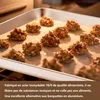 Cookies on a baking sheet in an oven. Voir les images du produit