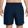 A person wearing navy blue NIKE SWIM men's volley shorts. Podgląd zdjęcia produktu
