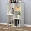 A white, open bookshelf with several compartments, filled with decorative items and books. Náhled obrázku produktu