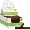 A display box filled with dog chew rolls, with some rolls spilling out and two lying in front. Podgląd zdjęcia produktu