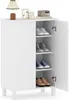 A white shoe cabinet with its doors open, displaying shoes on its shelves. Produktbild-Vorschau