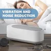 A person sleeping in bed with a cleaning device in the foreground. Produktbild-Vorschau