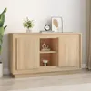 A wooden sideboard with two doors and an open shelf in the middle, decorated with a vase of flowers, a clock, and a framed picture on top. Produktbild-Vorschau