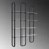 A modern black metal and wood bookshelf against a gradient gray background. Podgląd zdjęcia produktu